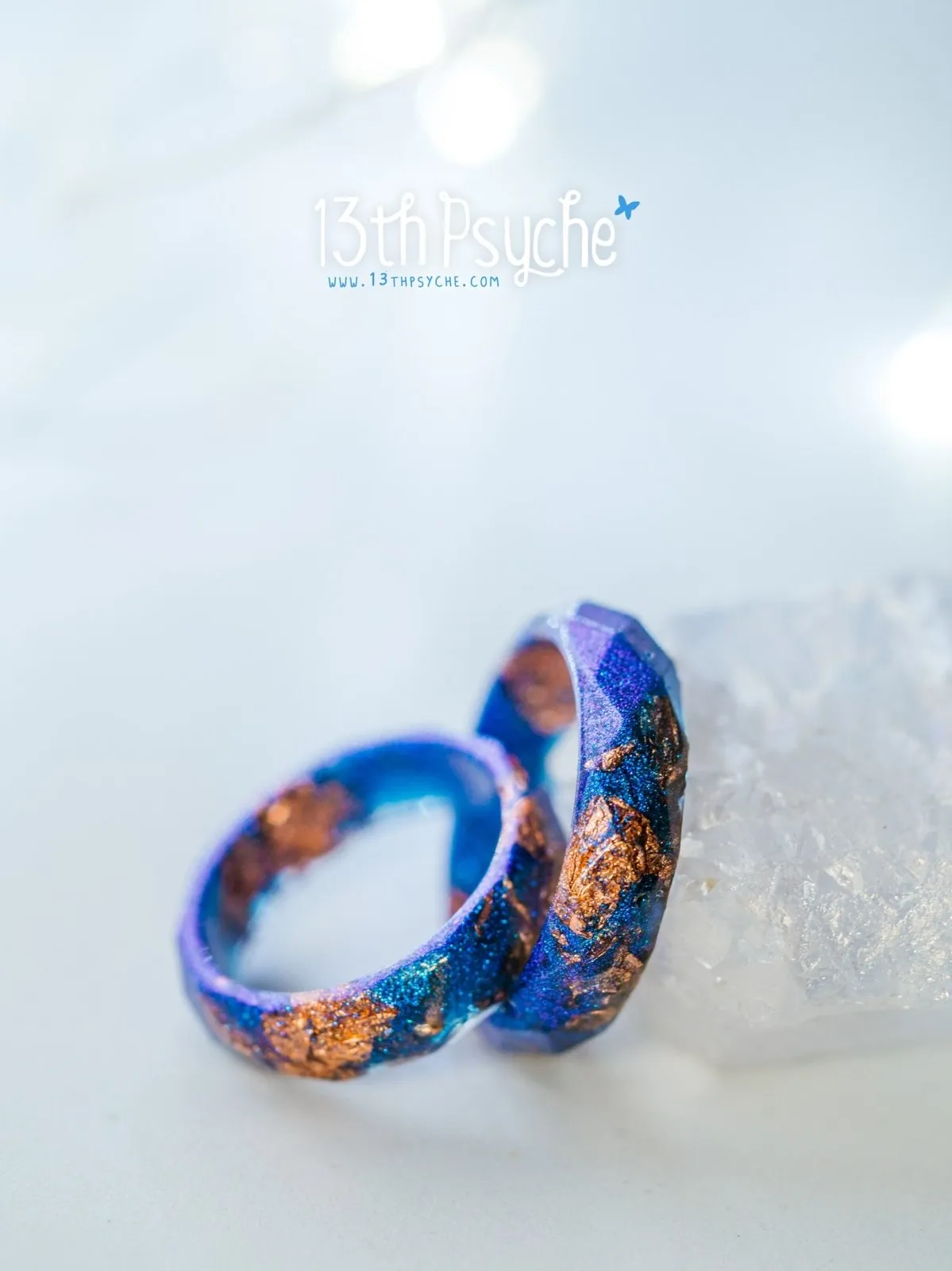 Iridescent blue faceted resin ring with rose gold flakes